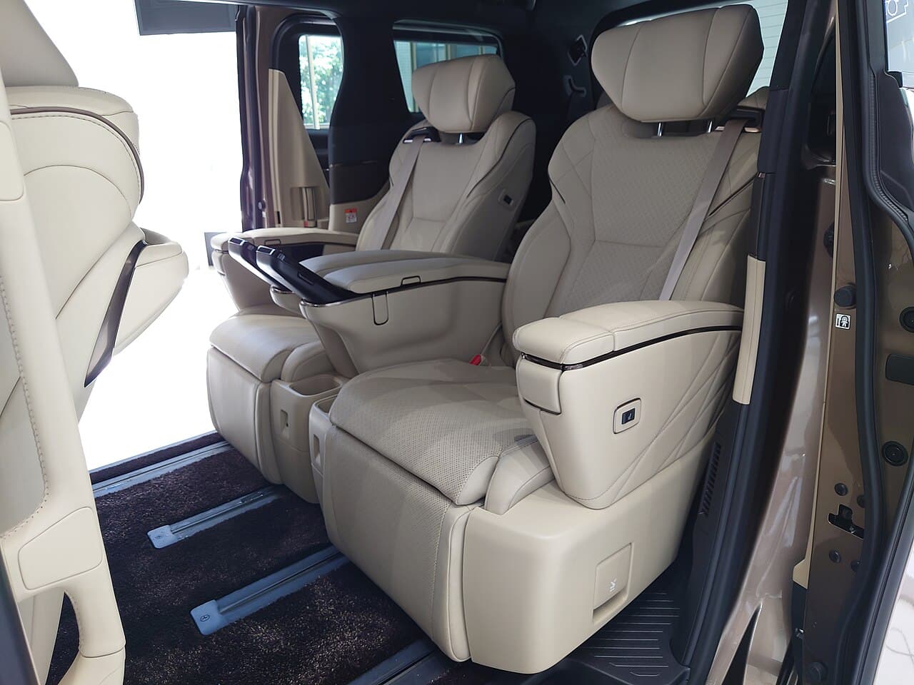 Cream captain seats in the second row of a Toyota Alphard